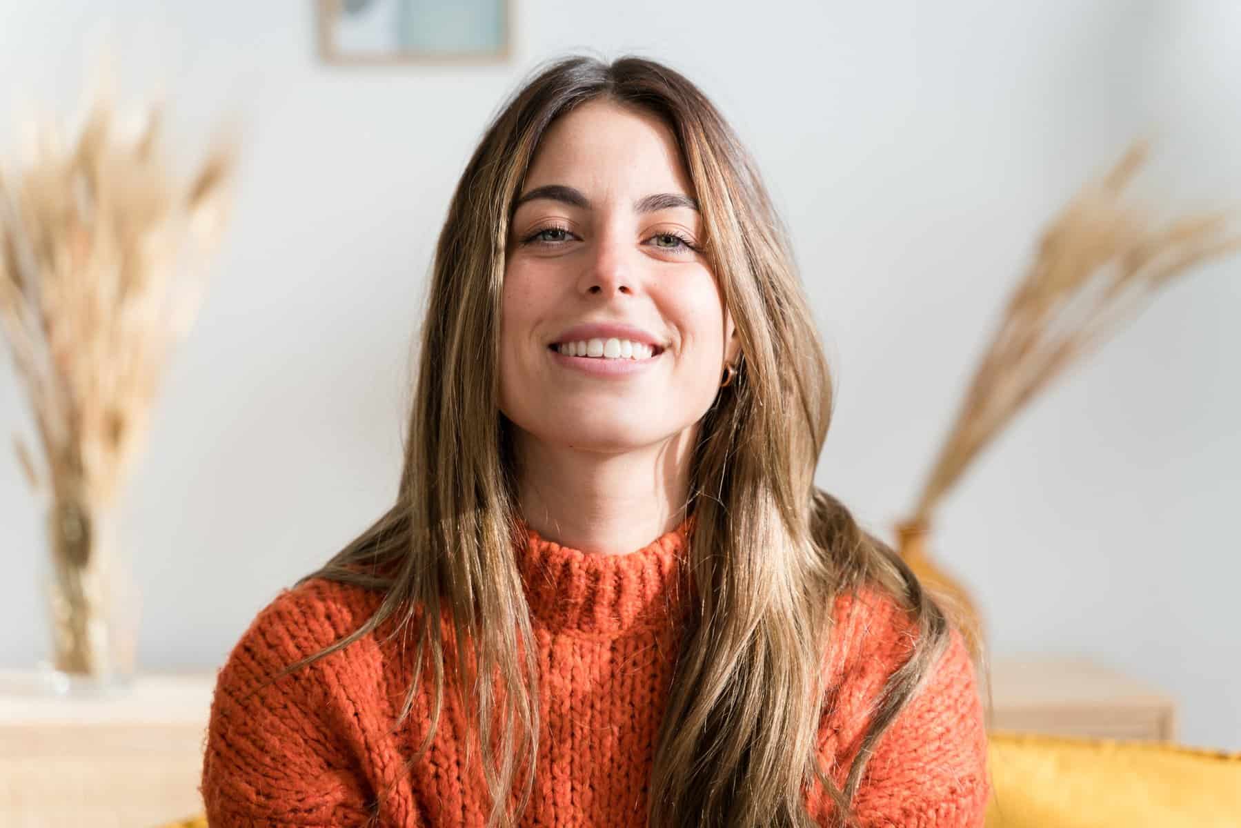 Young smiling woman at living room